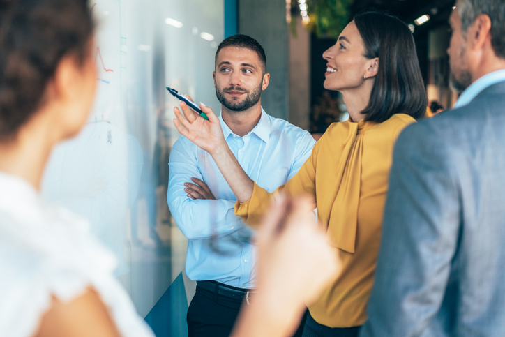 Cisco WebEx – Business team brainstorming at a white board – Growing Business